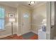 Bright and inviting foyer features elegant trim, hardwood floors, and decorative lighting at 1781 Brittlebush Ln, Johns Island, SC 29455