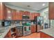 Well-equipped kitchen features stainless steel appliances, granite countertops, and ample cabinet space at 1781 Brittlebush Ln, Johns Island, SC 29455