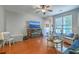 Spacious living room features hardwood floors, a decorative fireplace, and abundant natural light at 1781 Brittlebush Ln, Johns Island, SC 29455