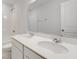 Bathroom features double sinks, white cabinets, white quartz countertops and a shower and bathtub combination at 1816 Casein St, Summerville, SC 29483