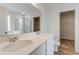 Bathroom featuring double sinks, quartz countertop, and access to walk-in closet at 1816 Casein St, Summerville, SC 29483