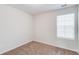 Bedroom features neutral paint, plush carpet, and ample natural light at 1816 Casein St, Summerville, SC 29483