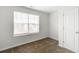 Bedroom with neutral walls and carpet, a bright window and a door at 1816 Casein St, Summerville, SC 29483