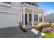 Covered front porch with craftsman columns and stone accents leads to the front door at 1816 Casein St, Summerville, SC 29483
