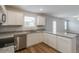 Bright kitchen features granite countertops, stainless steel appliances, and wood-look flooring at 1816 Casein St, Summerville, SC 29483
