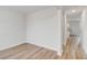 Open-concept living area with hardwood floors and light filled interior at 1816 Casein St, Summerville, SC 29483