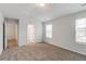 Bedroom with plush carpet, large closet, and access to the ensuite bathroom at 1816 Casein St, Summerville, SC 29483