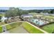 Aerial view of community pool area with pool house, playground and pond at 1816 Casein St, Summerville, SC 29483