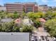 Aerial shot featuring rooftops of houses with lush trees and parking area near a building at 184 Ashley Ave, Charleston, SC 29403