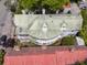 A close aerial view of a house with a rounded porch and red roof at 184 Ashley Ave, Charleston, SC 29403