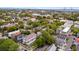 Expansive aerial view of a neighborhood with mature trees and a bridge in the distance at 184 Ashley Ave, Charleston, SC 29403