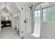 Modern bathroom featuring glass shower with white subway tile and marble floors for an elegant design at 184 Ashley Ave, Charleston, SC 29403