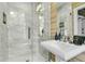 Modern bathroom showcasing a glass enclosed shower with white marble tiling and brushed metal fixtures at 184 Ashley Ave, Charleston, SC 29403