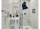 Elegant bathroom featuring a pedestal sink, glass shower, and stylish tile work at 184 Ashley Ave, Charleston, SC 29403