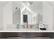 Bright bathroom featuring sleek vanity with bronze faucet and a modern white color palette at 184 Ashley Ave, Charleston, SC 29403