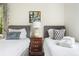 Comfortable bedroom featuring two beds, stylish decor, and a serene ambiance at 184 Ashley Ave, Charleston, SC 29403