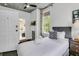 Cozy bedroom with an ensuite bathroom, and a view of the garden at 184 Ashley Ave, Charleston, SC 29403