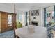 Cozy bedroom featuring a four poster bed, and access to a modern ensuite bathroom at 184 Ashley Ave, Charleston, SC 29403