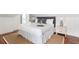 Comfortable bedroom featuring a king-size bed, decorative pillows, and bedside lamps at 184 Ashley Ave, Charleston, SC 29403
