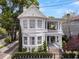 Elegant two-story home with a front porch, manicured lawn and a brick stairway at 184 Ashley Ave, Charleston, SC 29403