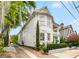 Elegant white home showcasing a classic design and well-maintained landscaping at 184 Ashley Ave, Charleston, SC 29403