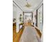 A home hallway features wooden floors and an open view to other parts of the house at 184 Ashley Ave, Charleston, SC 29403