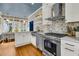 Bright, open kitchen with stainless appliances, tiled backsplash, and eat-in nook at 184 Ashley Ave, Charleston, SC 29403