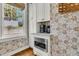 A cozy kitchen nook with stainless steel appliances and view to the outdoors at 184 Ashley Ave, Charleston, SC 29403