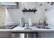 Cozy kitchenette with stainless steel appliances, marble countertop, and decorative shelving at 184 Ashley Ave, Charleston, SC 29403