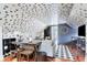 Inviting living area with comfortable seating, patterned wall, and warm lighting at 184 Ashley Ave, Charleston, SC 29403