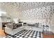 Stylish living room with a large sectional sofa, patterned walls, and unique decor at 184 Ashley Ave, Charleston, SC 29403