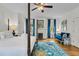Bright main bedroom featuring a four-poster bed, fireplace, and stylish blue accents at 184 Ashley Ave, Charleston, SC 29403