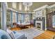 Luxurious main bedroom featuring a four-poster bed, decorative fireplace, and elegant wallpaper at 184 Ashley Ave, Charleston, SC 29403
