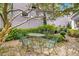 Charming brick patio features a round table and chairs, perfect for outdoor dining and relaxation at 184 Ashley Ave, Charleston, SC 29403