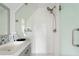 Bright shower with glass door, modern fixtures, and a hexagon tile floor at 184 Ashley Ave, Charleston, SC 29403