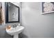 Powder room featuring a pedestal sink, a mirror, and gray paint at 204 Black Gum Cir, Moncks Corner, SC 29461