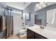 Well-lit bathroom featuring a shower-tub combo and large vanity sink at 204 Black Gum Cir, Moncks Corner, SC 29461
