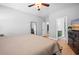 Cozy bedroom featuring hardwood floors, large windows, and closet access at 204 Black Gum Cir, Moncks Corner, SC 29461