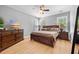 Primary bedroom featuring hardwood floors, large windows, and a ceiling fan at 204 Black Gum Cir, Moncks Corner, SC 29461