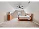 Attic bedroom featuring a large bed, dresser, and bright natural light at 204 Black Gum Cir, Moncks Corner, SC 29461
