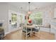 Charming dining area with ample natural light and view to the outdoor living area at 204 Black Gum Cir, Moncks Corner, SC 29461