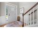Welcoming entryway features a staircase, wainscoting, and a stylish rug that creates a warm and inviting atmosphere at 204 Black Gum Cir, Moncks Corner, SC 29461