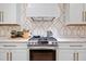 Modern kitchen with stainless steel range and white marble countertops at 204 Black Gum Cir, Moncks Corner, SC 29461