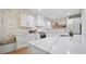 Kitchen with white cabinets, marble countertops, decorative backsplash and stainless steel range at 204 Black Gum Cir, Moncks Corner, SC 29461