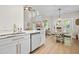 Open kitchen with quartz countertops, white cabinets and stainless steel appliances at 204 Black Gum Cir, Moncks Corner, SC 29461