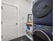 Laundry room featuring a stackable washer and dryer and storage shelves at 204 Black Gum Cir, Moncks Corner, SC 29461