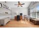 Bright home office with desk, shelving, and ample natural light, creating a productive workspace at 204 Black Gum Cir, Moncks Corner, SC 29461