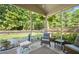 Serene screened porch with comfortable seating and a tranquil backyard view at 204 Black Gum Cir, Moncks Corner, SC 29461