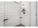 Shower stall with white subway tile, glass door, and built-in shelves at 204 Black Gum Cir, Moncks Corner, SC 29461