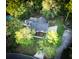 Aerial view of a house with a fenced yard, a wooden deck, a private pool, and mature trees in a suburban setting at 213 Factors Walk, Summerville, SC 29485